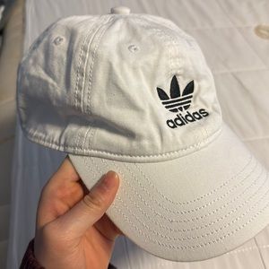 Adidas white cap with black adjustable strap